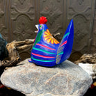 Side view of multicolored stripes in blue, red, and yellow, accented by geometric patterns.