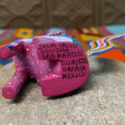 Base of Oaxacan coyote wood carving signed by Julia Calvo Olivera and marked San Martín Tilcajete, Oaxaca, Mexico.