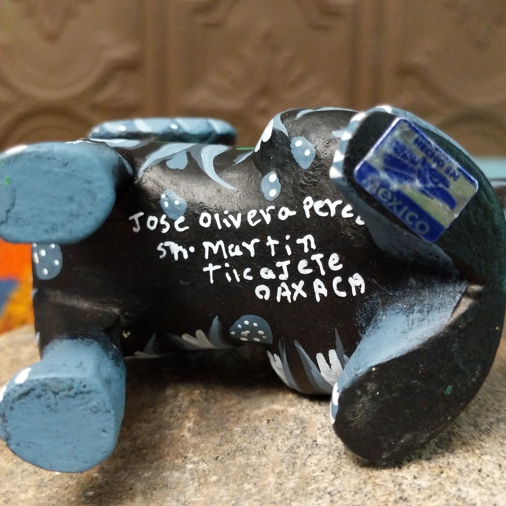 Base of Oaxacan dog wood carving signed by Jose Olivera Perez and marked San Martín Tilcajete, Oaxaca, Mexico.