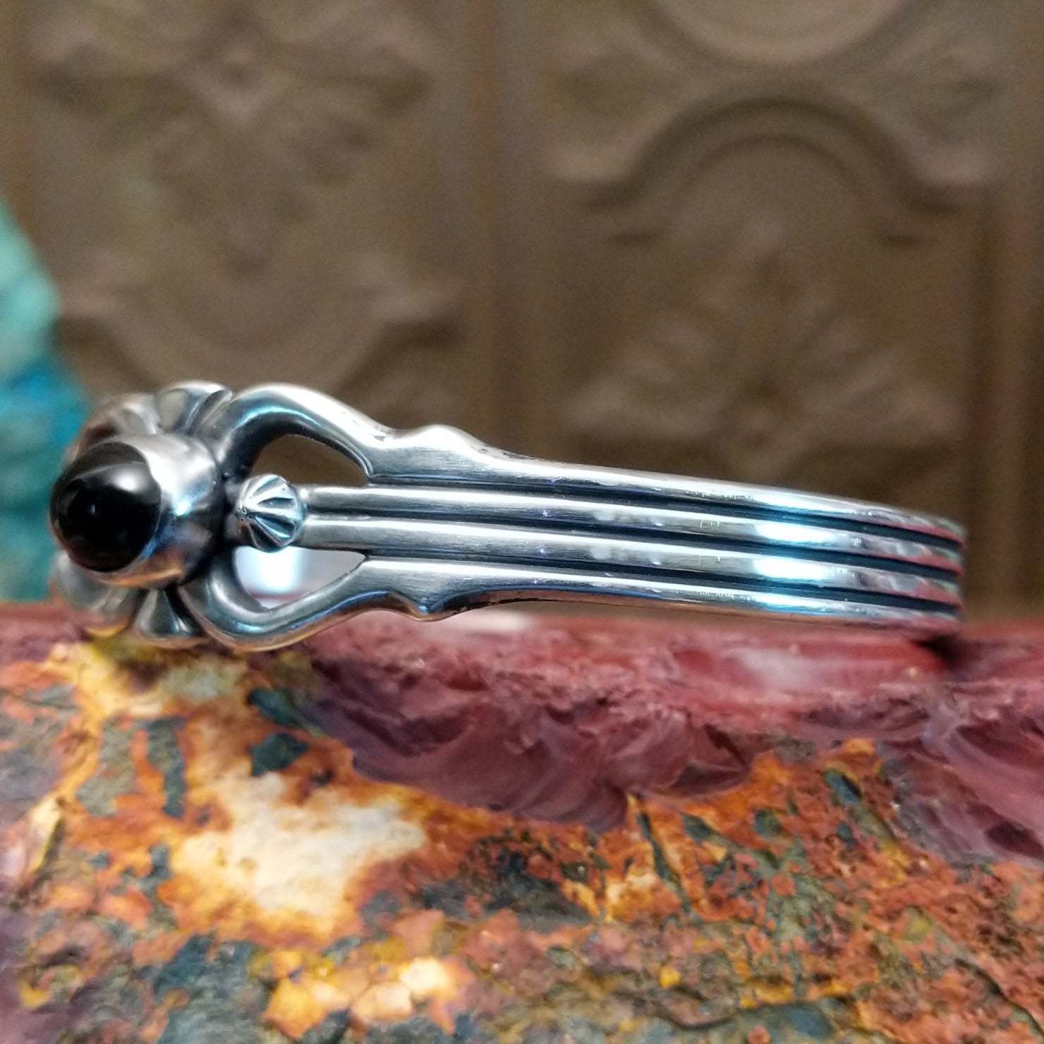 Sterling silver cuff featuring black onyx set in an oval bezel.
