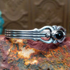 Sterling silver cuff featuring black onyx set in an oval bezel.