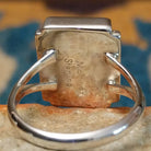 Handcrafted sterling silver orange spiny oyster and manmade opal ring by Sheryl Martinez, featuring a rectangular inlay with shimmering opal accents; artisan and Sterling Silver stamp.