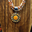 Orange Spiny Oyster shell pendant set on the sterling silver bezel.