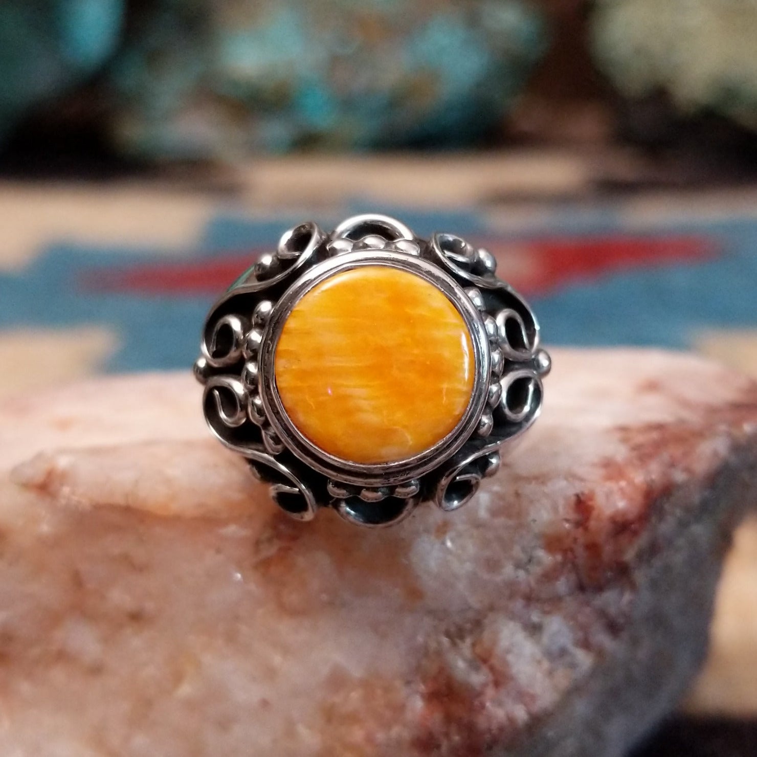 Sterling silver ring featuring orange spiny oyster shell.