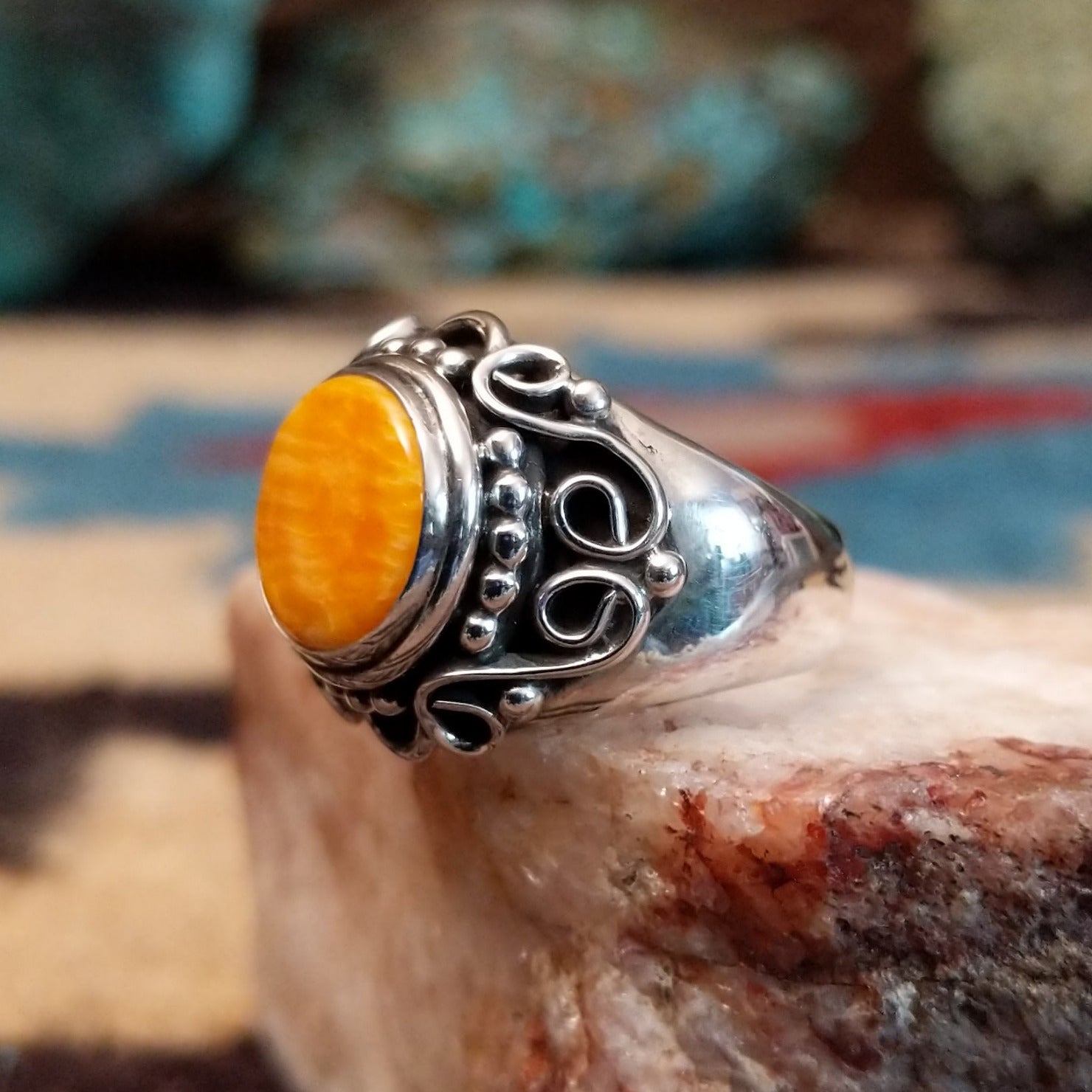 Sterling silver ring featuring orange spiny oyster shell.