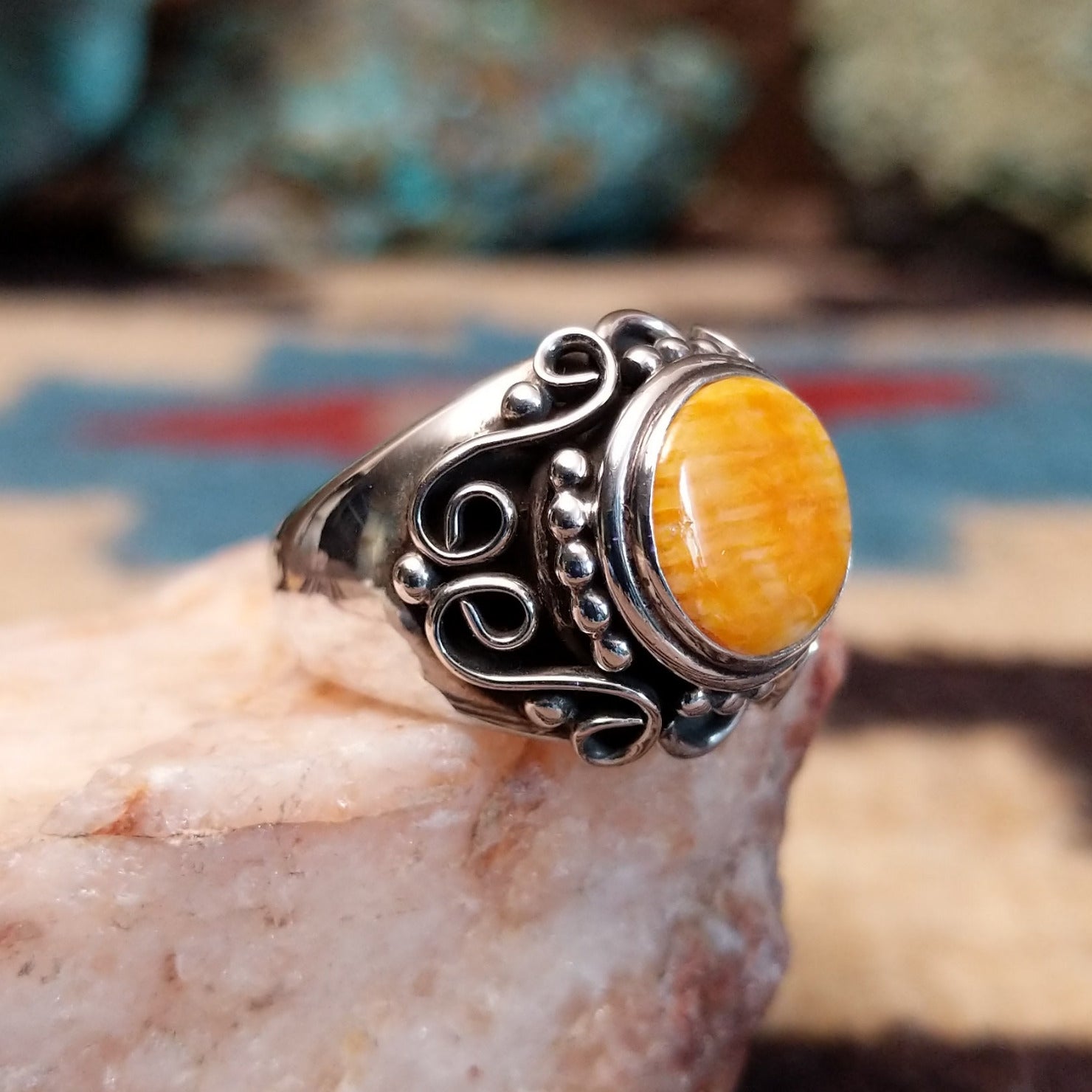 Sterling silver ring featuring orange spiny oyster shell.