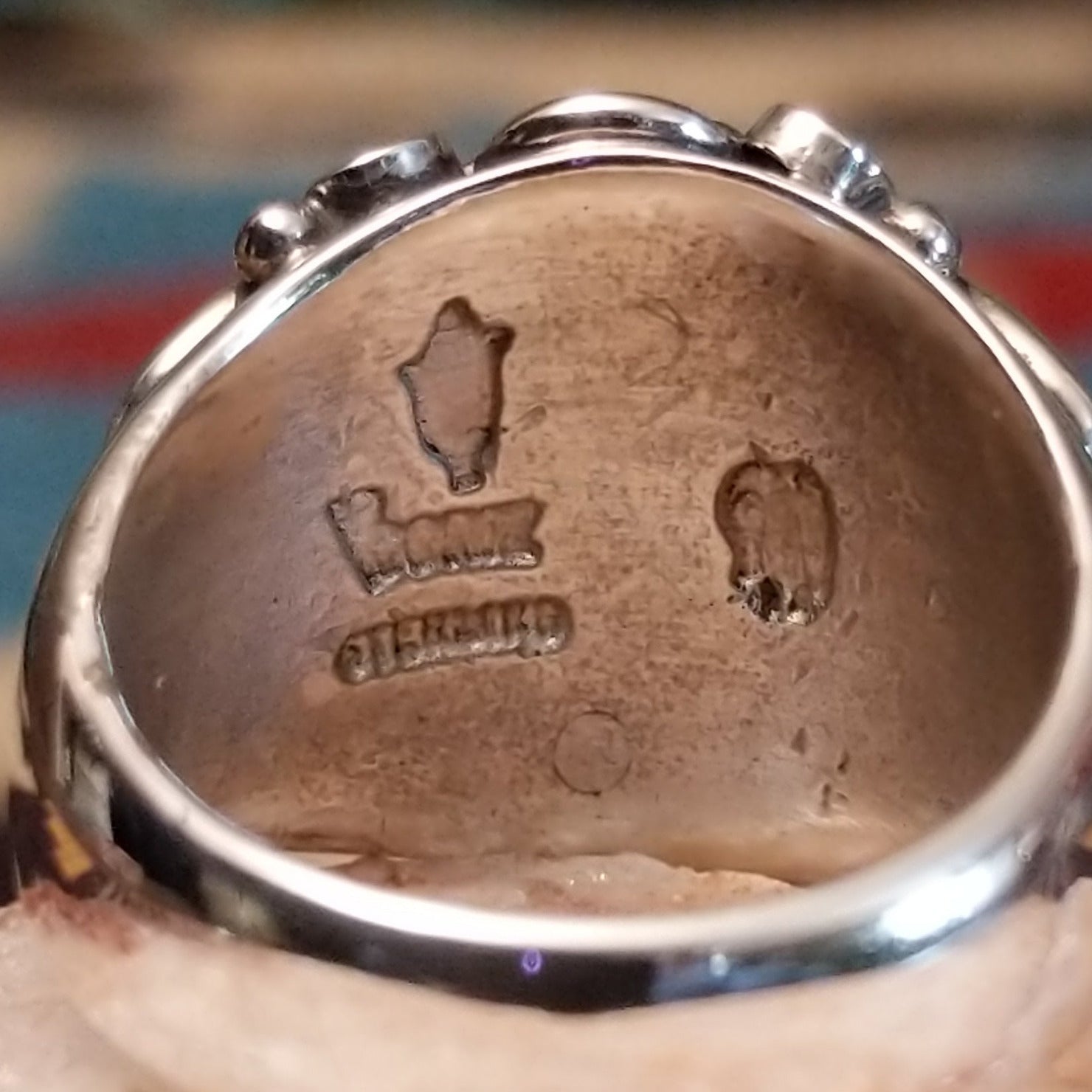 Close up of artists stamped signature.