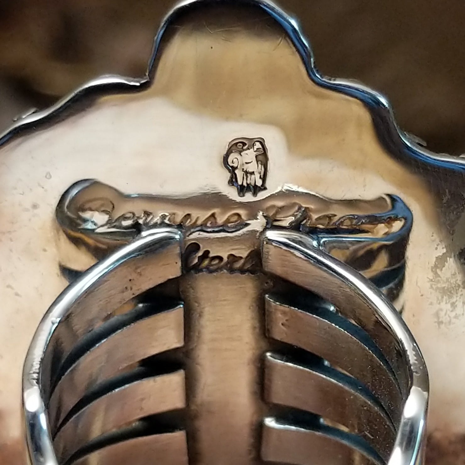 Close-up of the artisan's stamped signature.