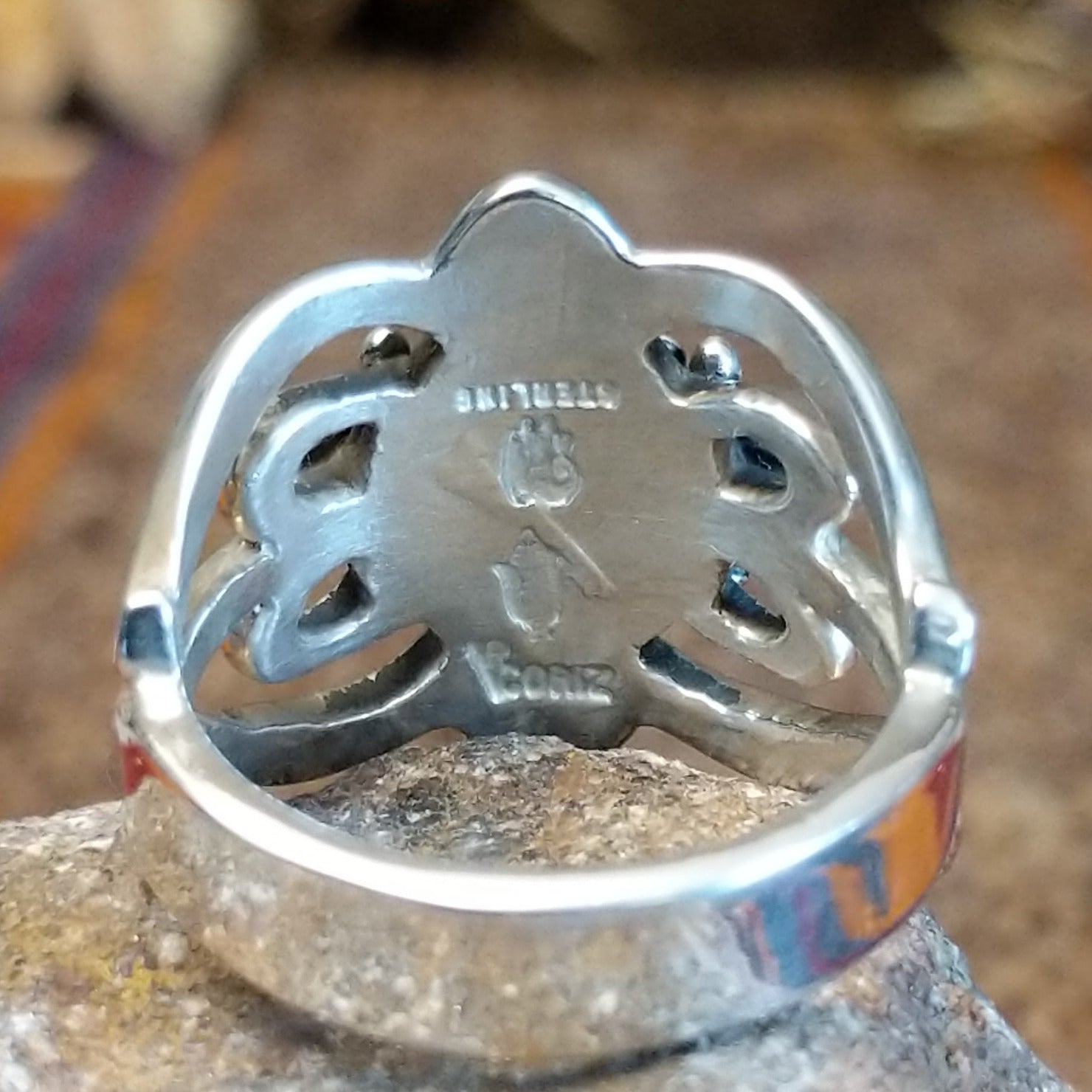 Close-up of the artisan's stamped signature.