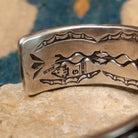 Handcrafted sterling silver cuff by Andrew Gordon featuring a Kingman turquoise cabochon with a twisted rope bezel, surrounded by ornate conchos, fan motifs, silver beadwork, and hand-stamped Southwestern details; artisan and Sterling Silver stamp.