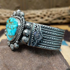 Kingman turquoise cuff by Michael Calladitto, featuring a blue Kingman turquoise stone with a natural brown matrix set in a handcrafted sterling silver cuff;  side view.