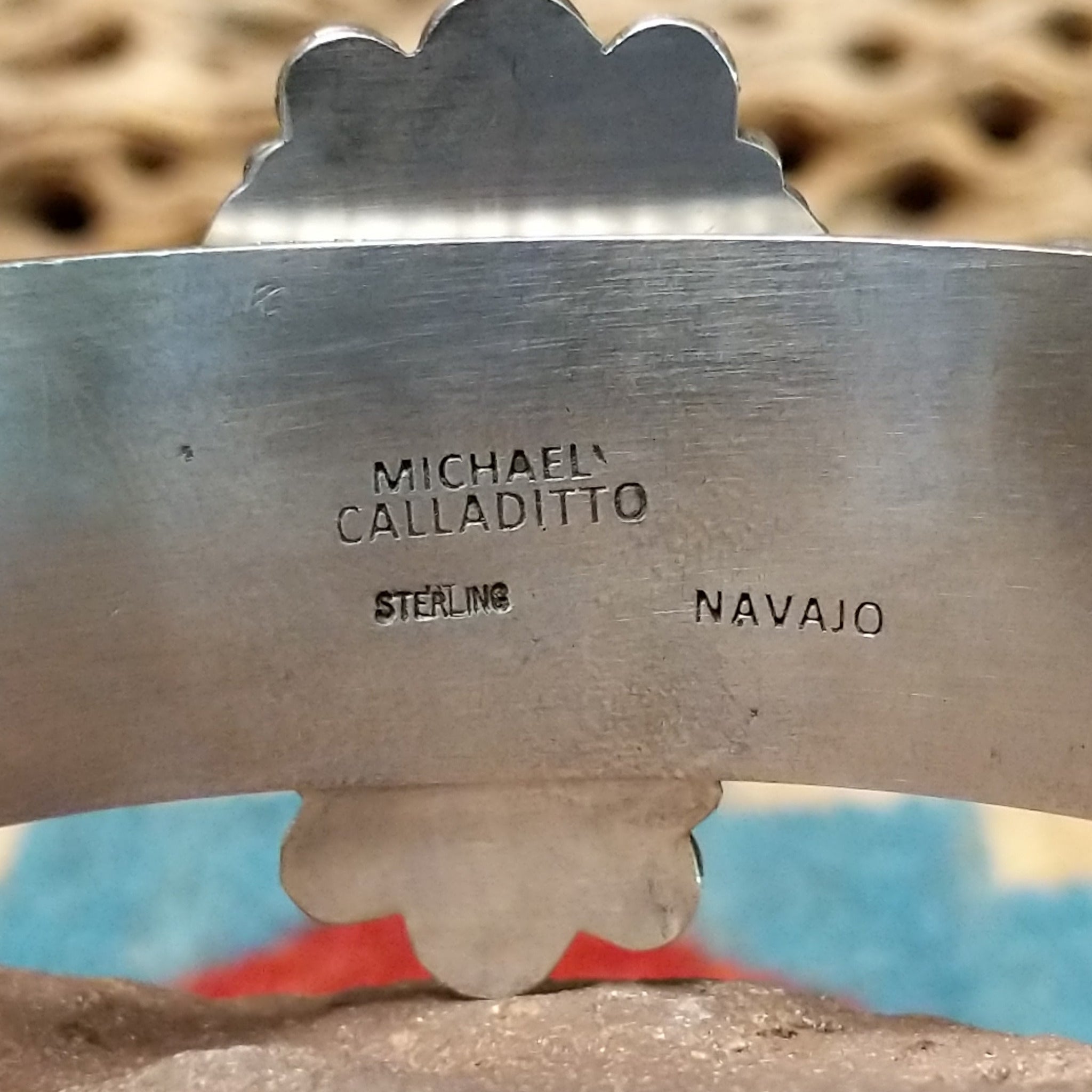 Kingman turquoise cuff by Michael Calladitto, featuring a blue Kingman turquoise stone with a natural brown matrix set in a handcrafted sterling silver cuff; artisan, tribe, and Sterling Silver stamp.