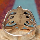 Ornate Lapis Ring by Raymond Coriz featuring an oval blue lapis stone set in Sterling Silver with twisted rope, polished bead accents, sculpted details, and decorative openwork; artisan and Sterling Silver stamp.