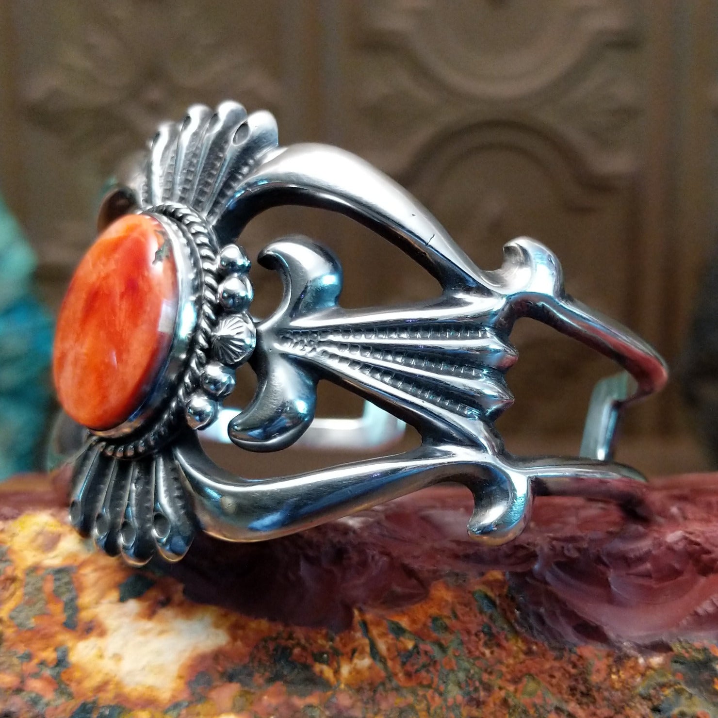 Sterling silver cuff featuring red spiny oyster shell set in the oval bezel.