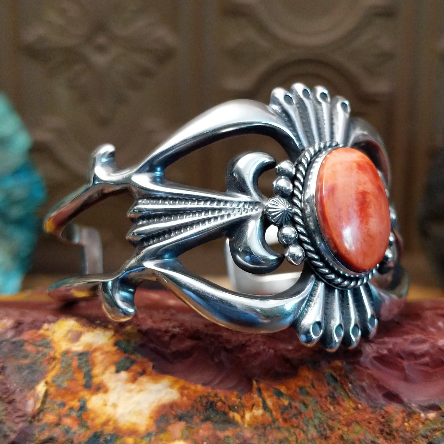 Sterling silver cuff featuring red spiny oyster shell set in the oval bezel.