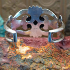 Sterling silver cuff featuring red spiny oyster shell set in the oval bezel.