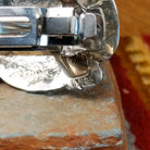 Close up of the artist's stamped signature.