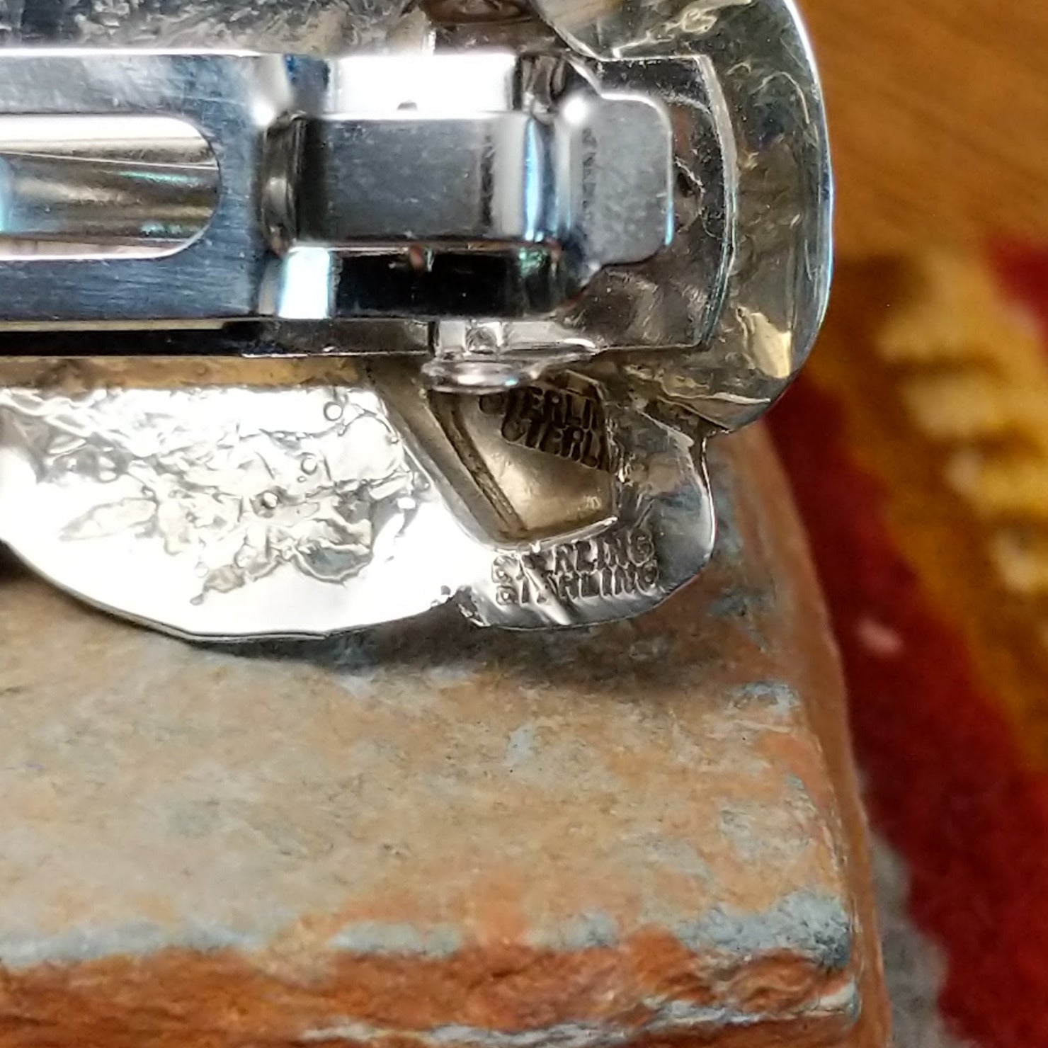 Close up of the artist's stamped signature.