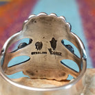 Close up of the artist's stamped signature