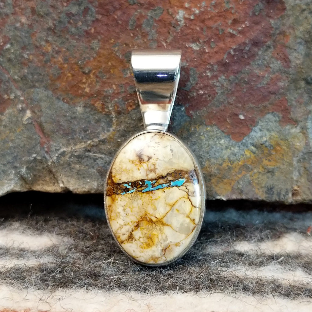 Sterling silver pendant with boulder turquoise set in the bezel.