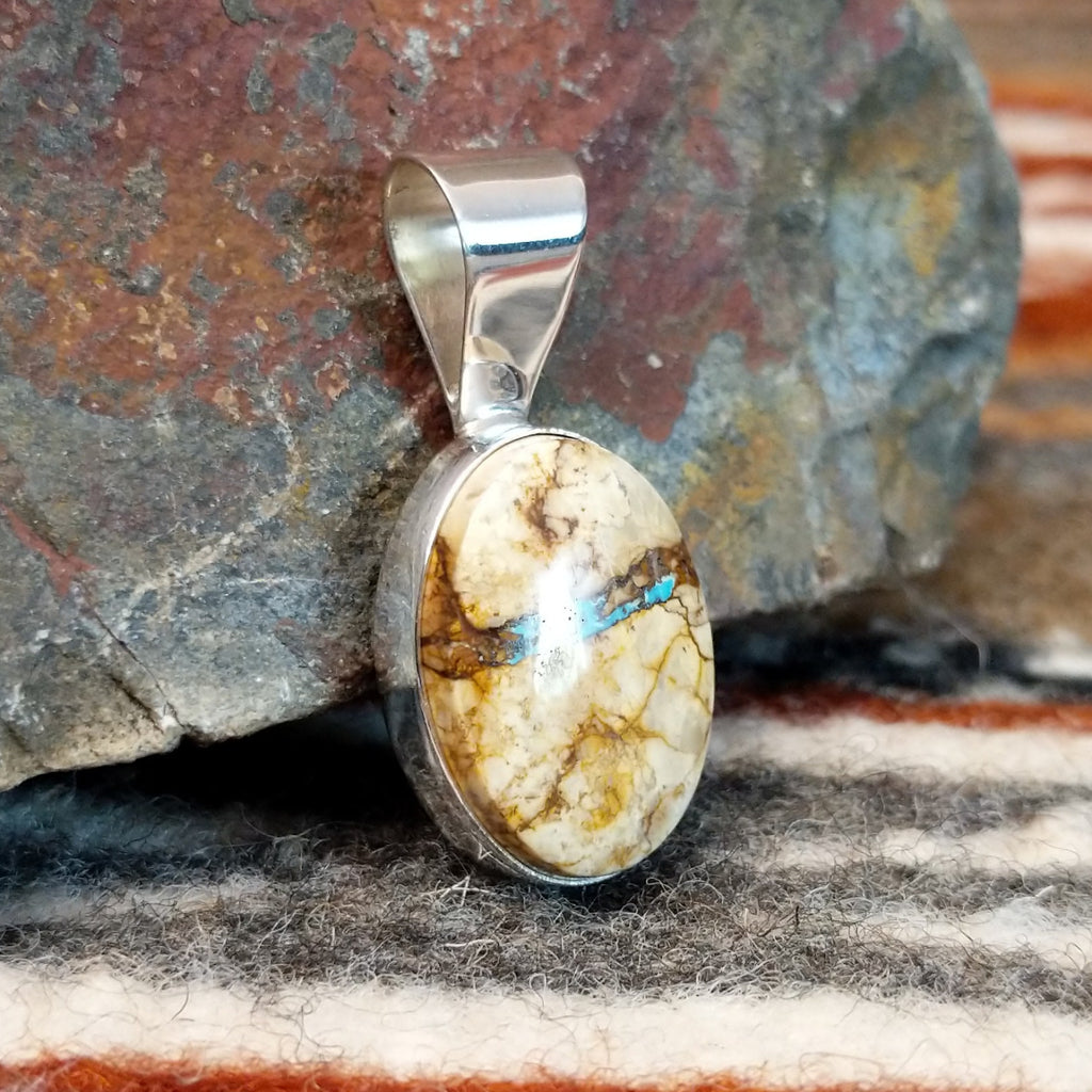 Sterling silver pendant with boulder turquoise set in the bezel.