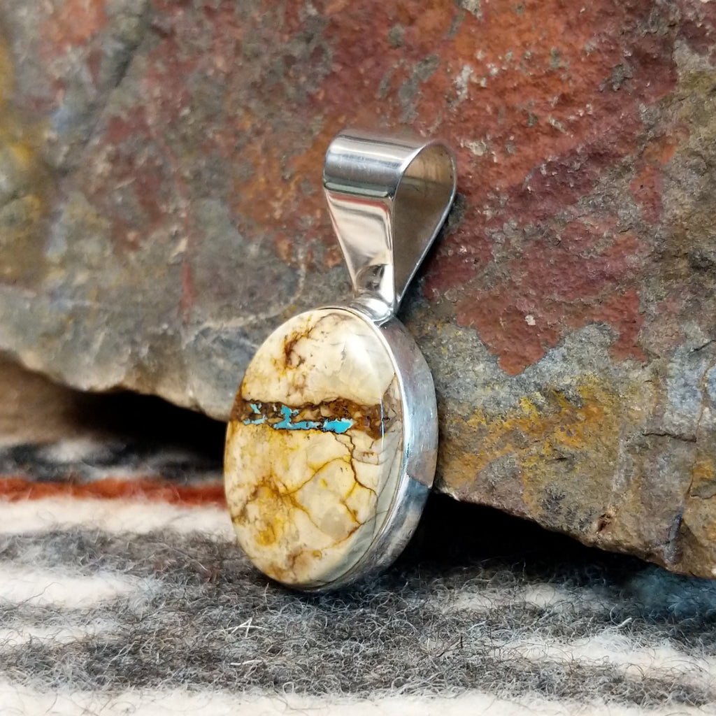 Sterling silver pendant with boulder turquoise set in the bezel.