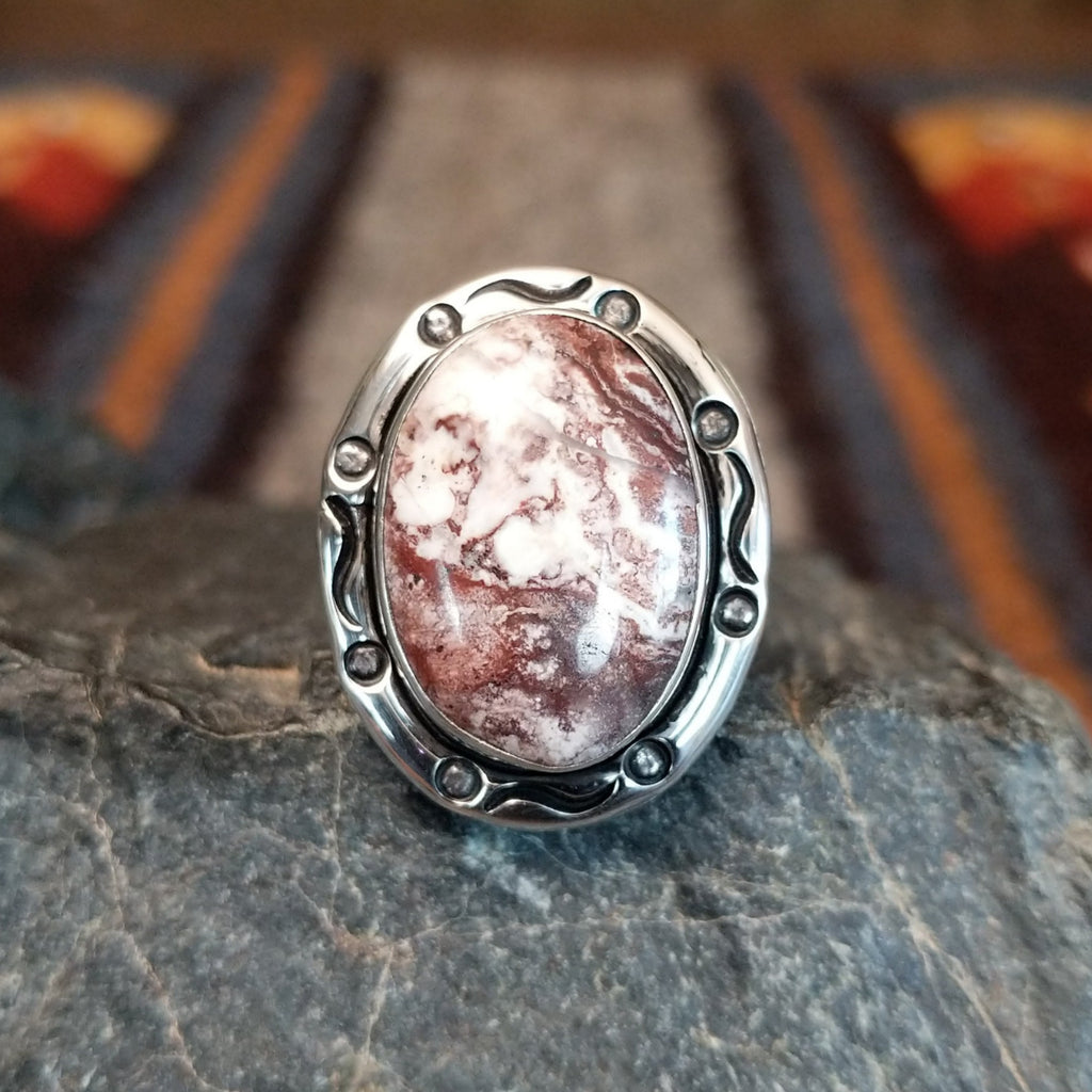 Wild horse stone set in an intricately stamped silver bezel.
