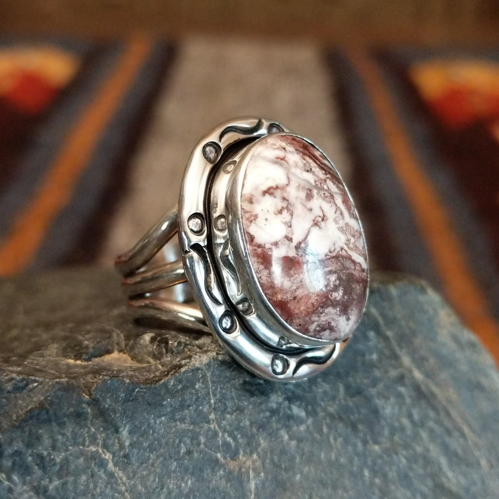 Wild horse stone set in an intricately stamped silver bezel.