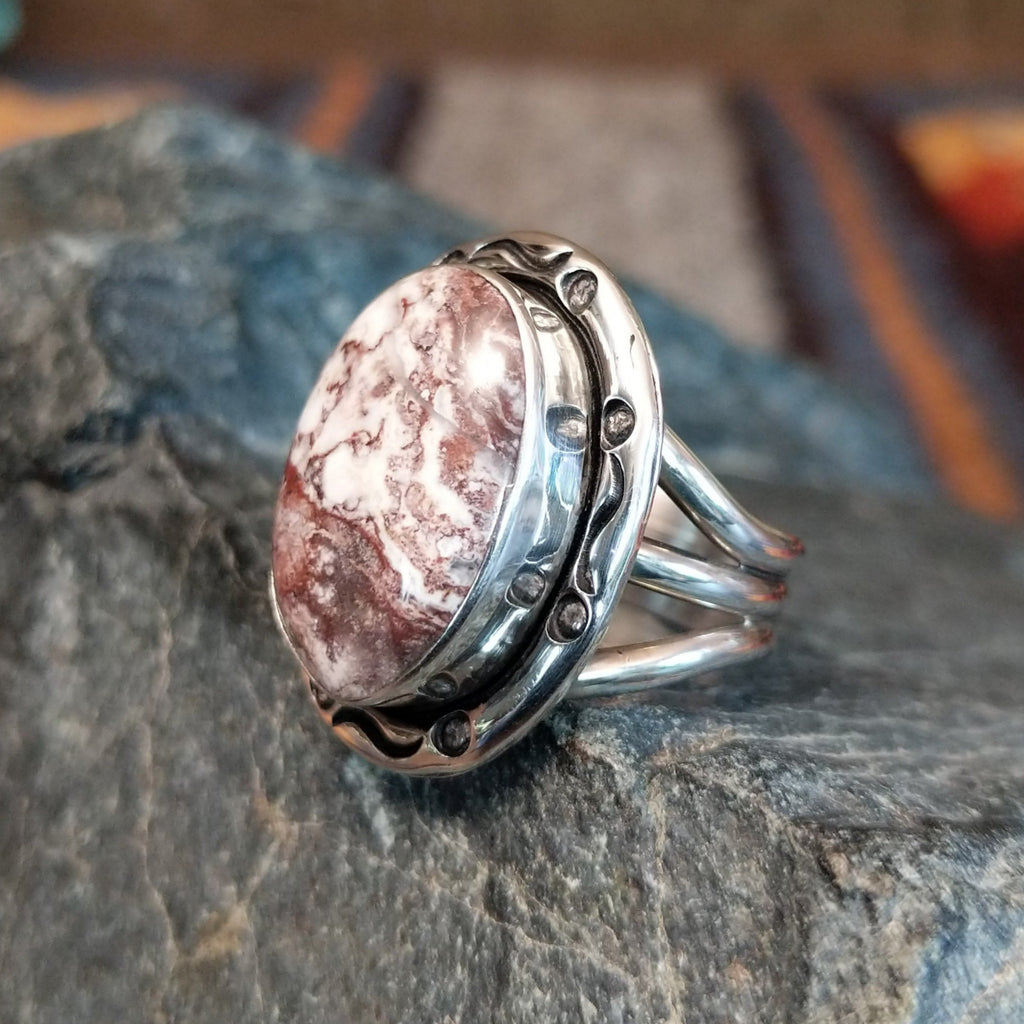 Wild horse stone set in an intricately stamped silver bezel.