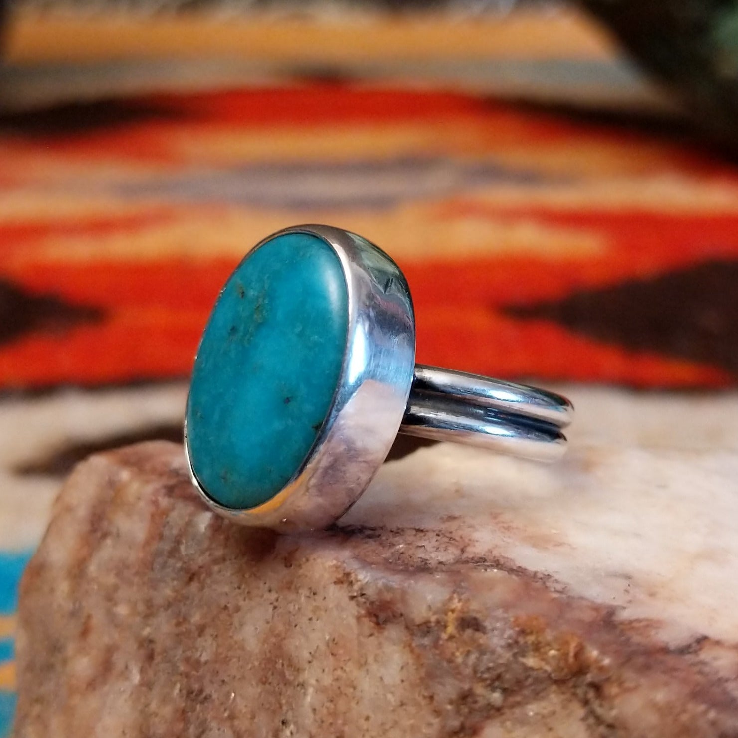 Sterling silver ring with Kingman turquoise set in the oval bezel.