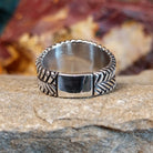 The band of the ring is in a dual braided sterling silver design.