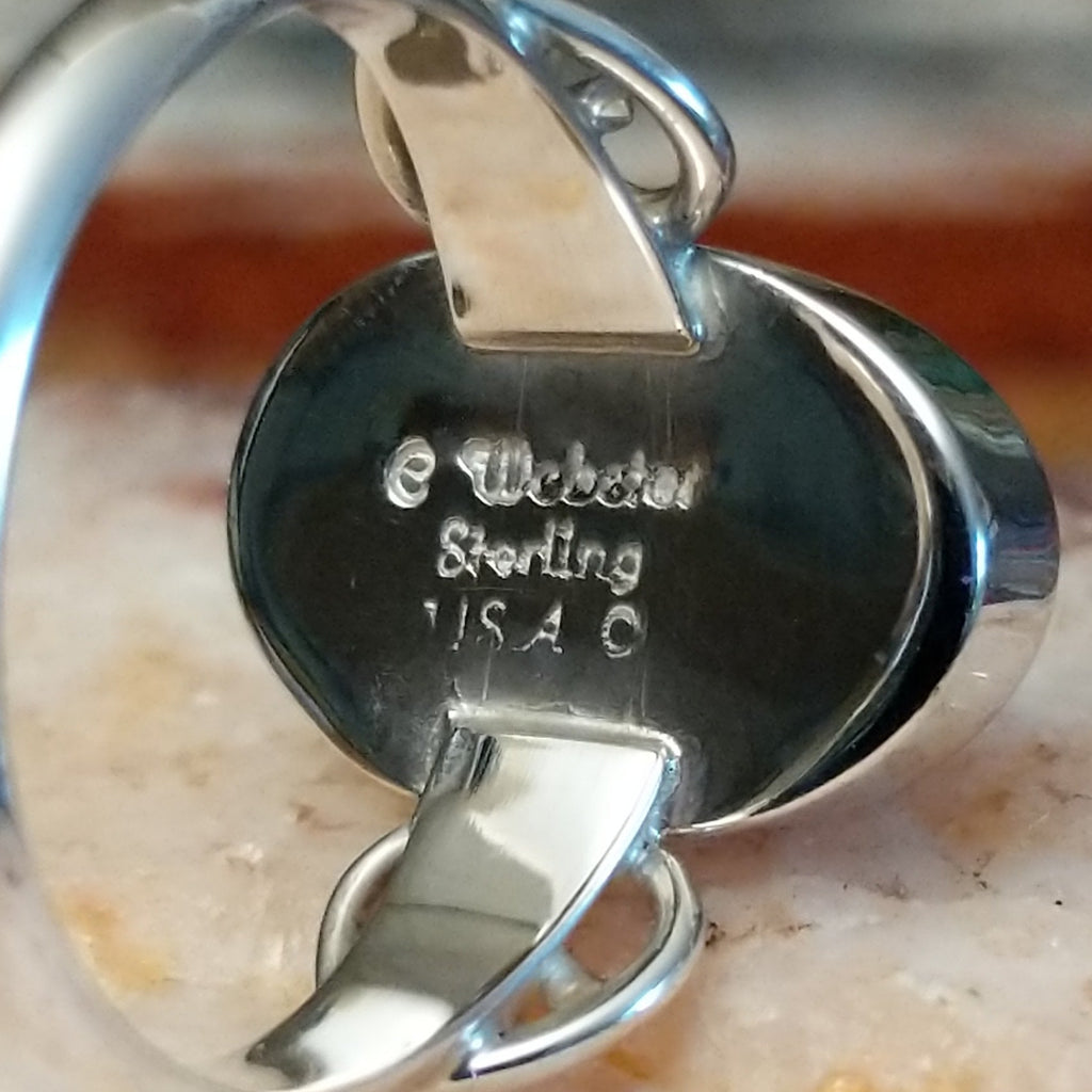 Close-up of the artisan's stamped signature.