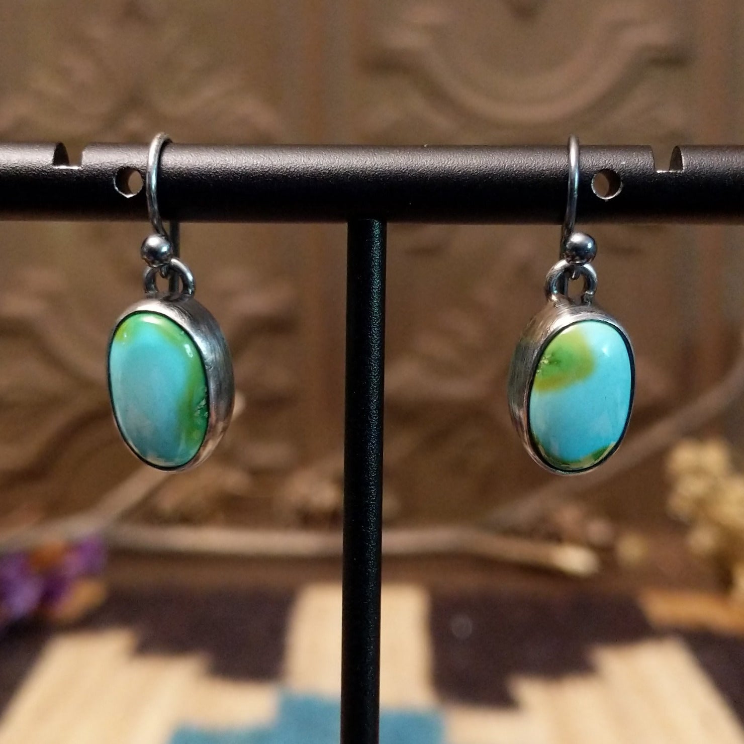 Sterling silver earrings with Sonoran gold turquoise set in oval bezels.