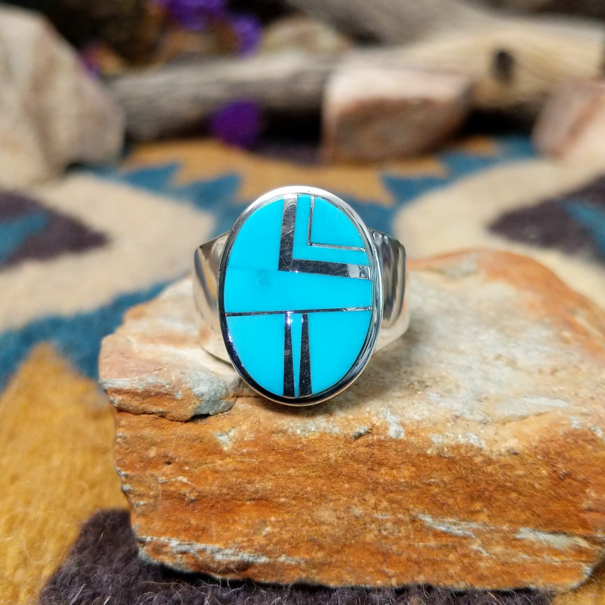 Sterling silver oval Turquoise inlay ring by Valerie Yazzie with geometric silver accents.