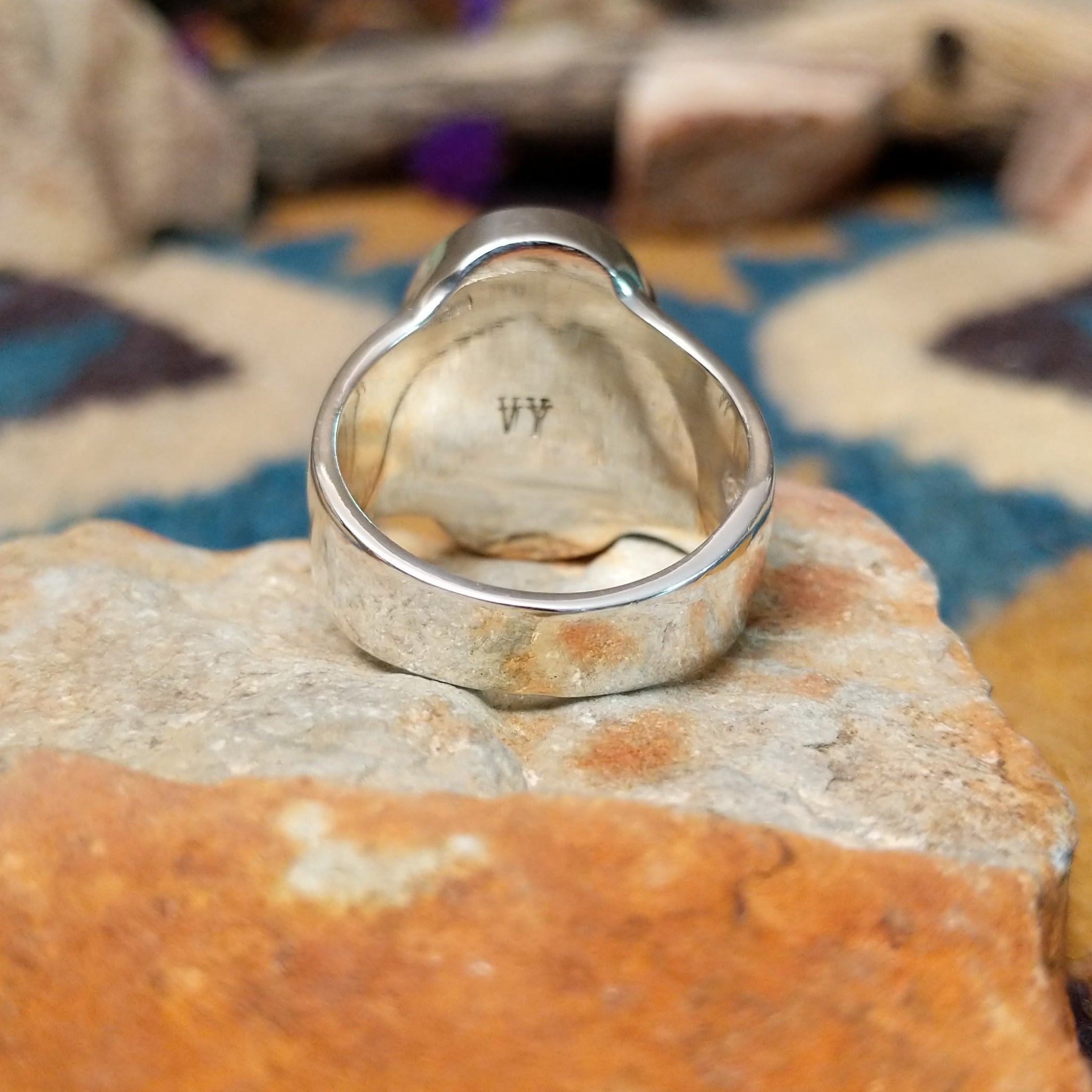 Sterling silver oval Turquoise inlay ring by Valerie Yazzie with geometric silver accents; underside view.