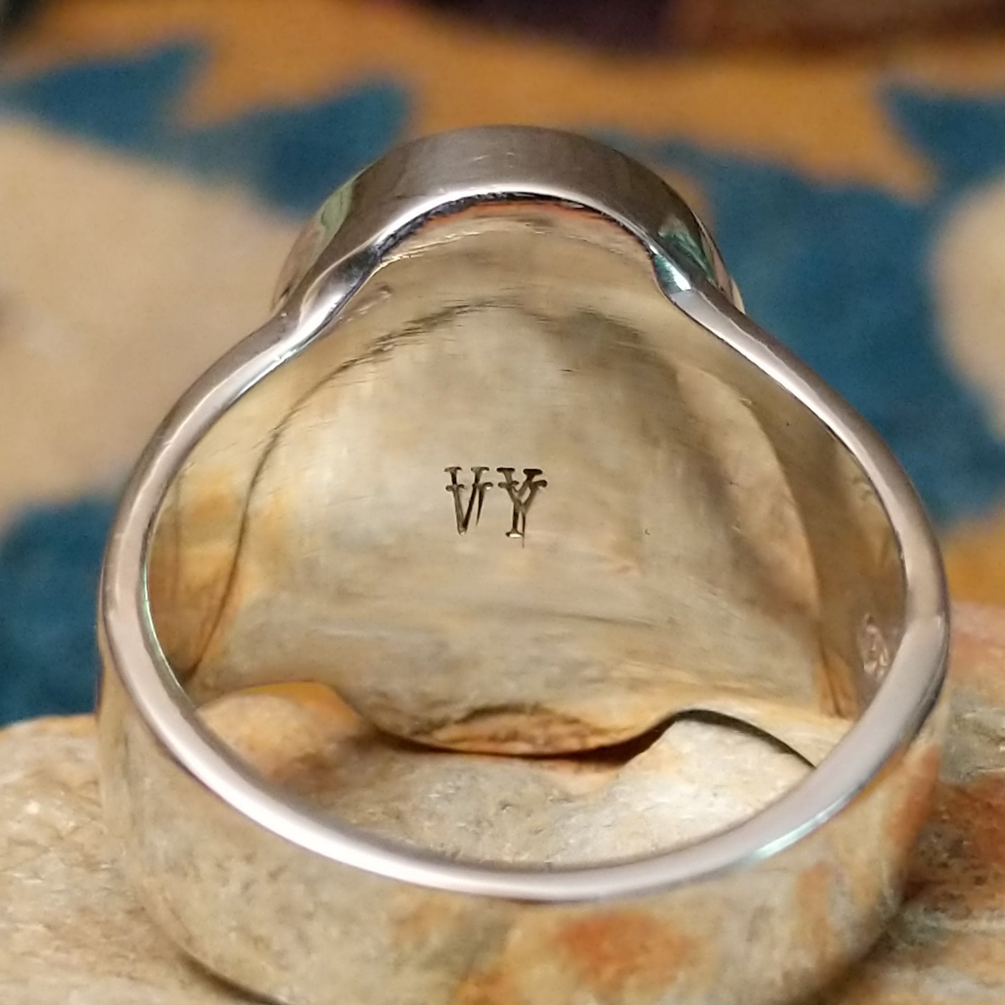 Sterling silver oval Turquoise inlay ring by Valerie Yazzie with geometric silver accents; artisan stamp.