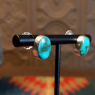 Sterling silver earrings with sonoran gold turquoise set in oval bezels.