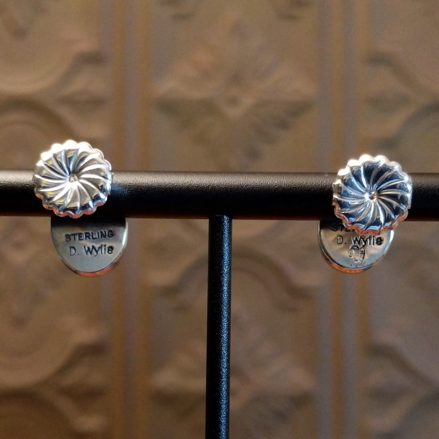 Close-up of the artisan's stamped signature.