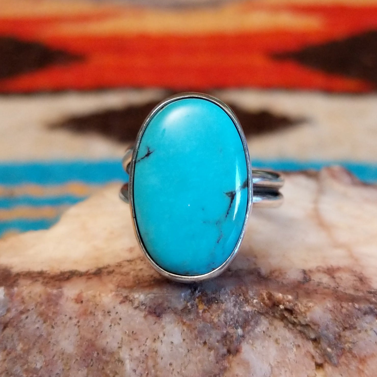 Sterling silver ring with Kingman turquoise set in the large oval bezel.