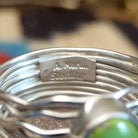 Close-up of the artisan's stamped signature.
