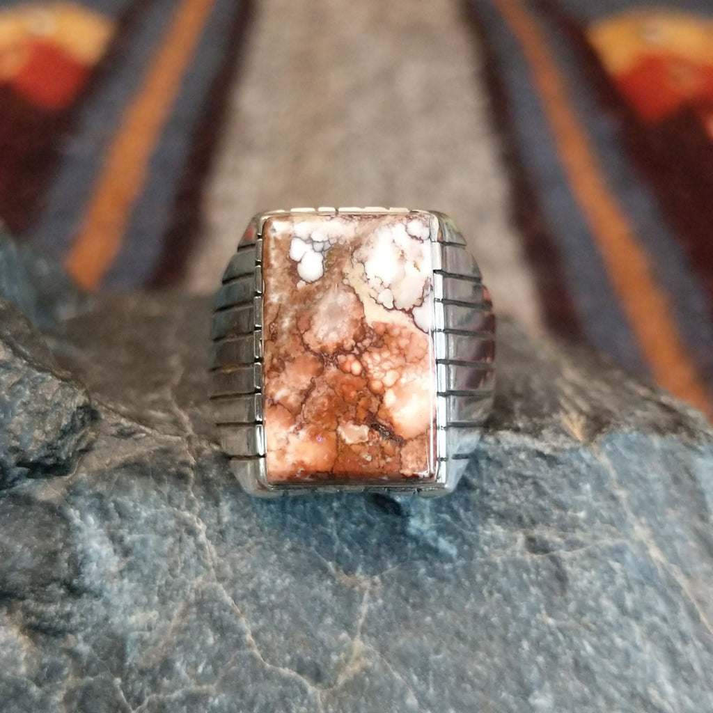 The front of the rectangular ring showcases the stunning brown matrix of the wild horse.