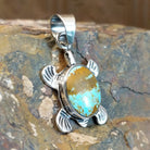 Handcrafted by Navajo artist K.S., this  pendant features genuine #8 Turquoise set in sterling silver. 