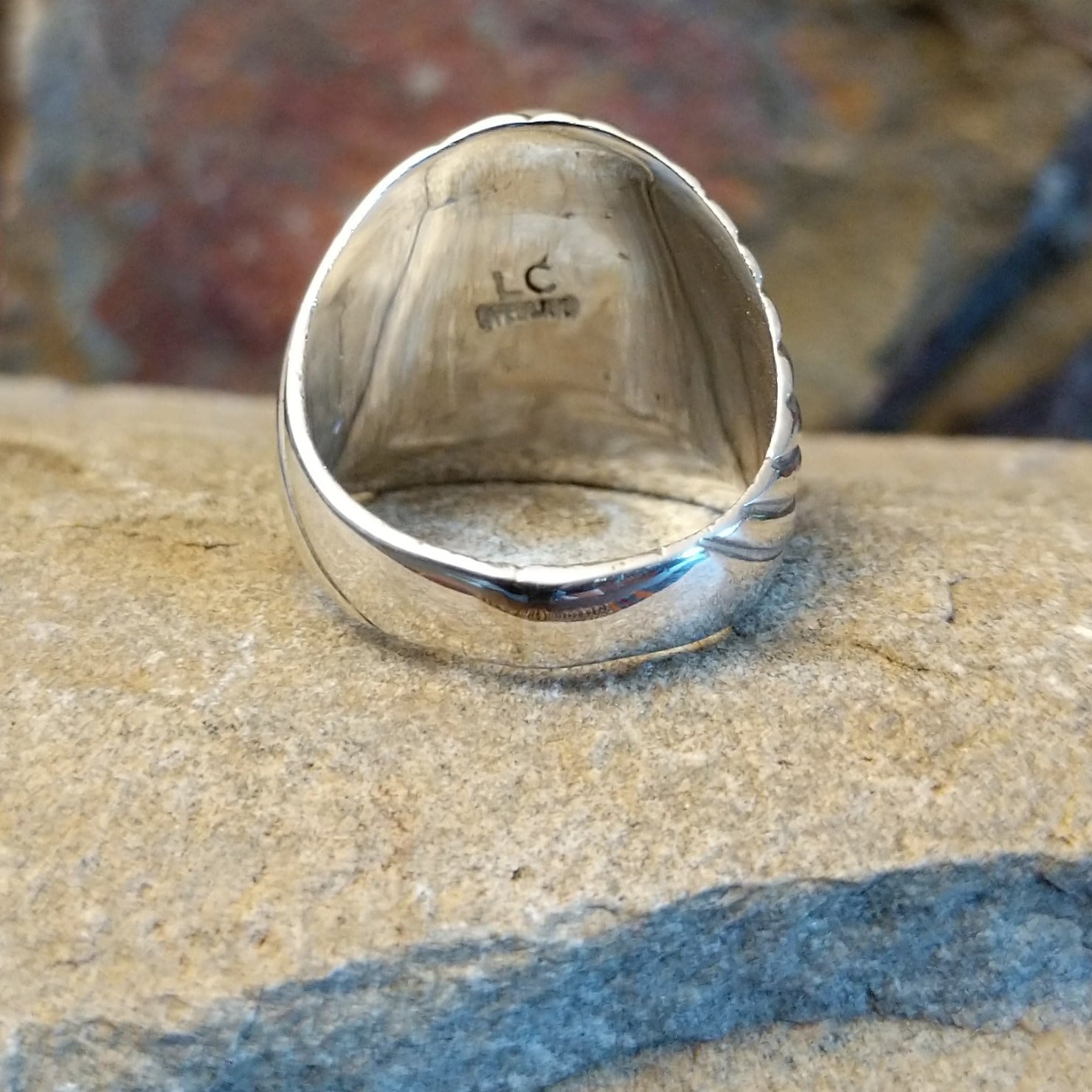 Artisan and Sterling Silver stamp on underside of ring.