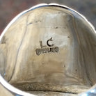 Artisan and Sterling Stamp on underside of ring.
