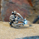 Sterling silver ring by Navajo artist Raymond Coriz, crafted in solid sterling silver. Size 13, side view.