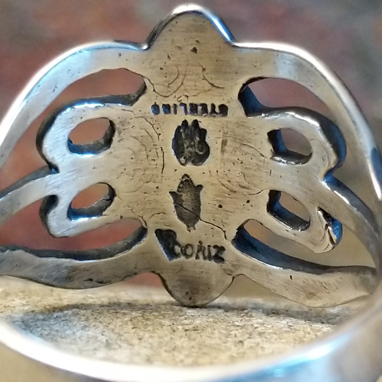 Underside of ring showing artisan and Sterling Silver stamp.