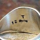 Artisan and Sterling Silver stamp; underside of ring.
