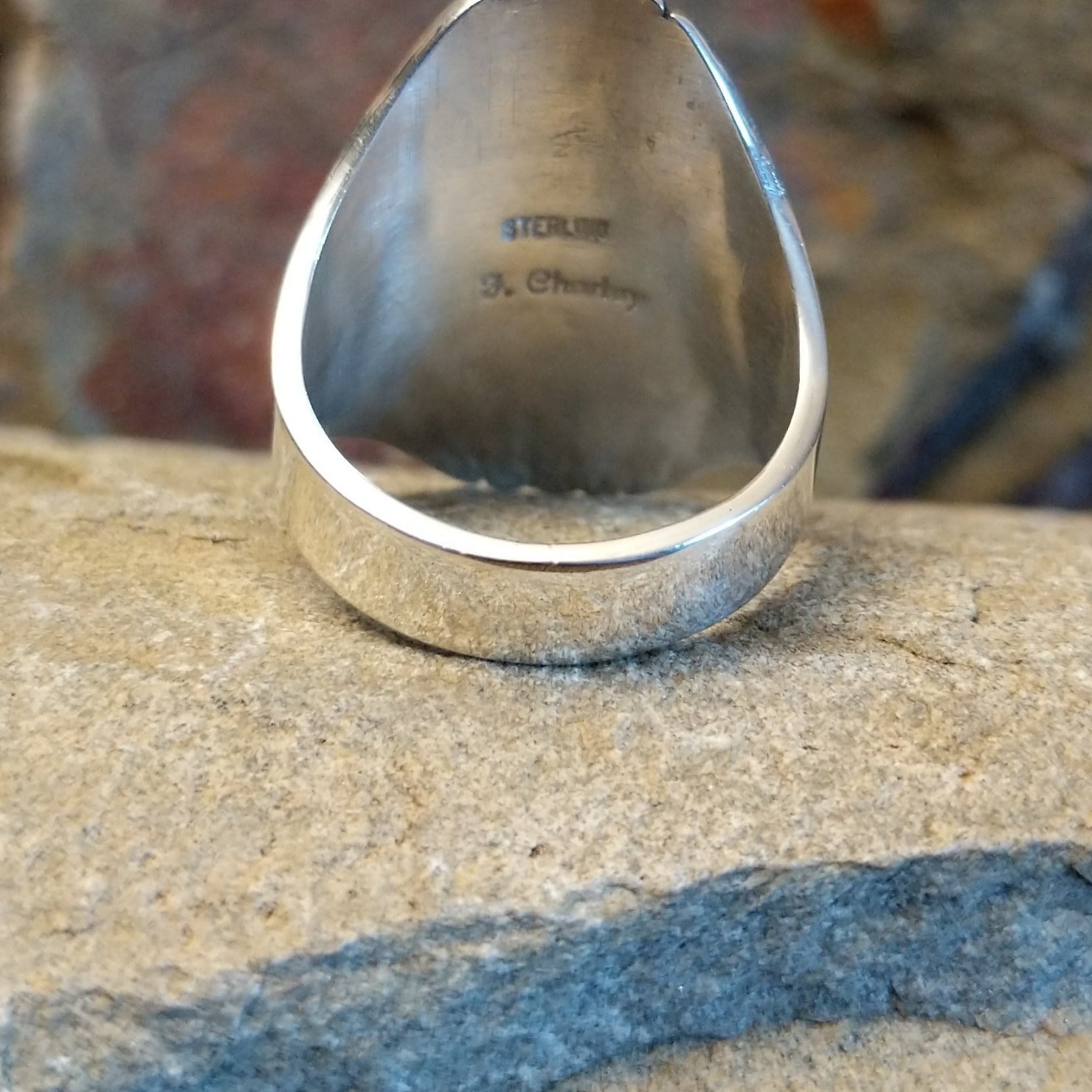 Artisan and Sterling Silver stamp; underside of ring.