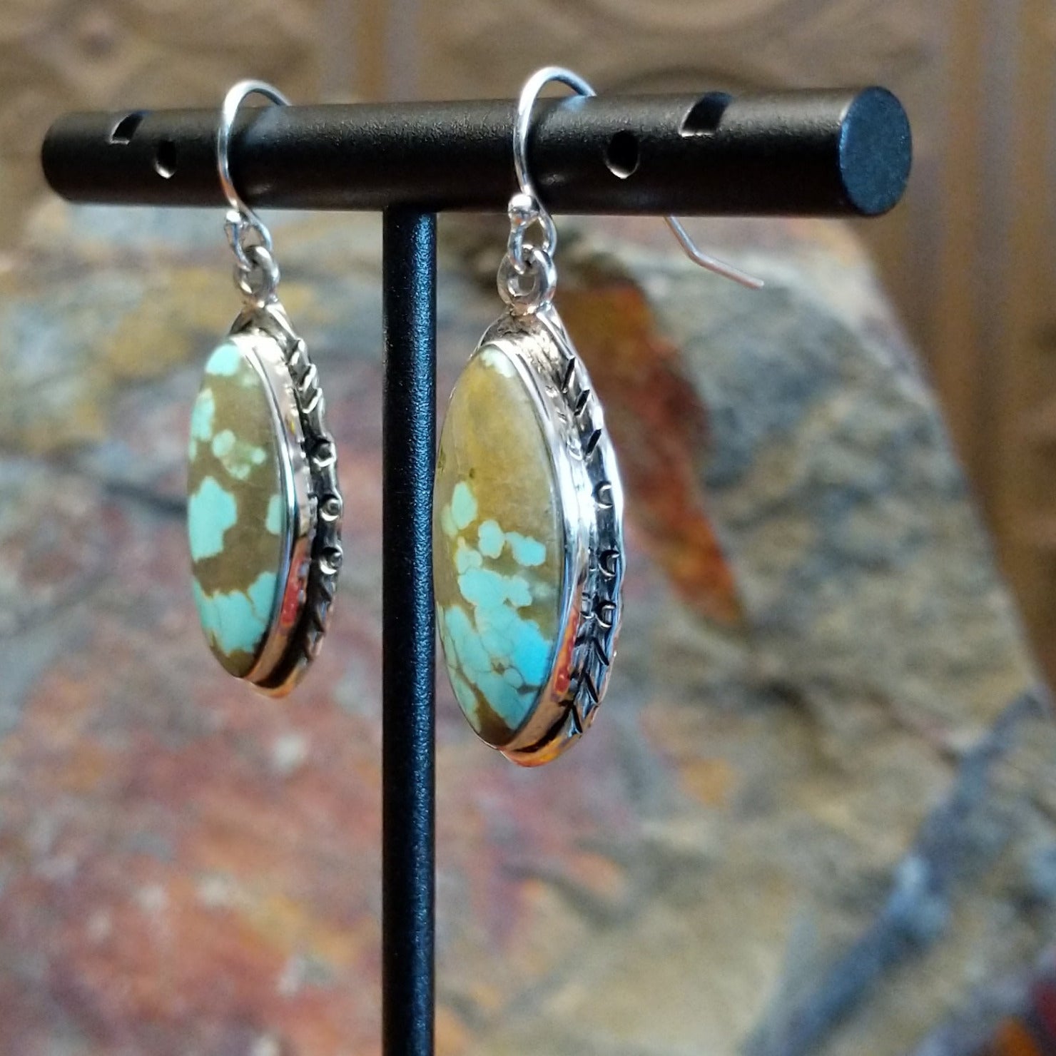  #8 Turquoise ellipse French hook earrings by Navajo artist John King, side view.