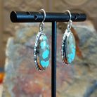  #8 Turquoise ellipse French hook earrings by Navajo artist John King, side view.